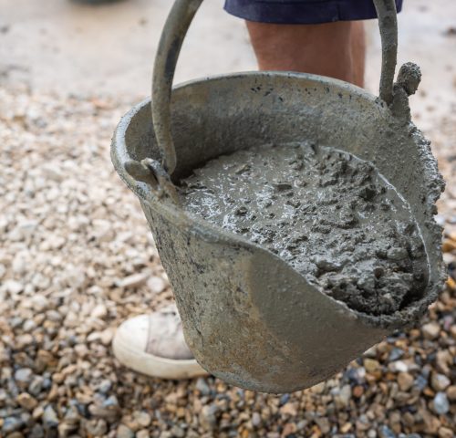Construction technicians are mixing cement, stone, sand for construction.